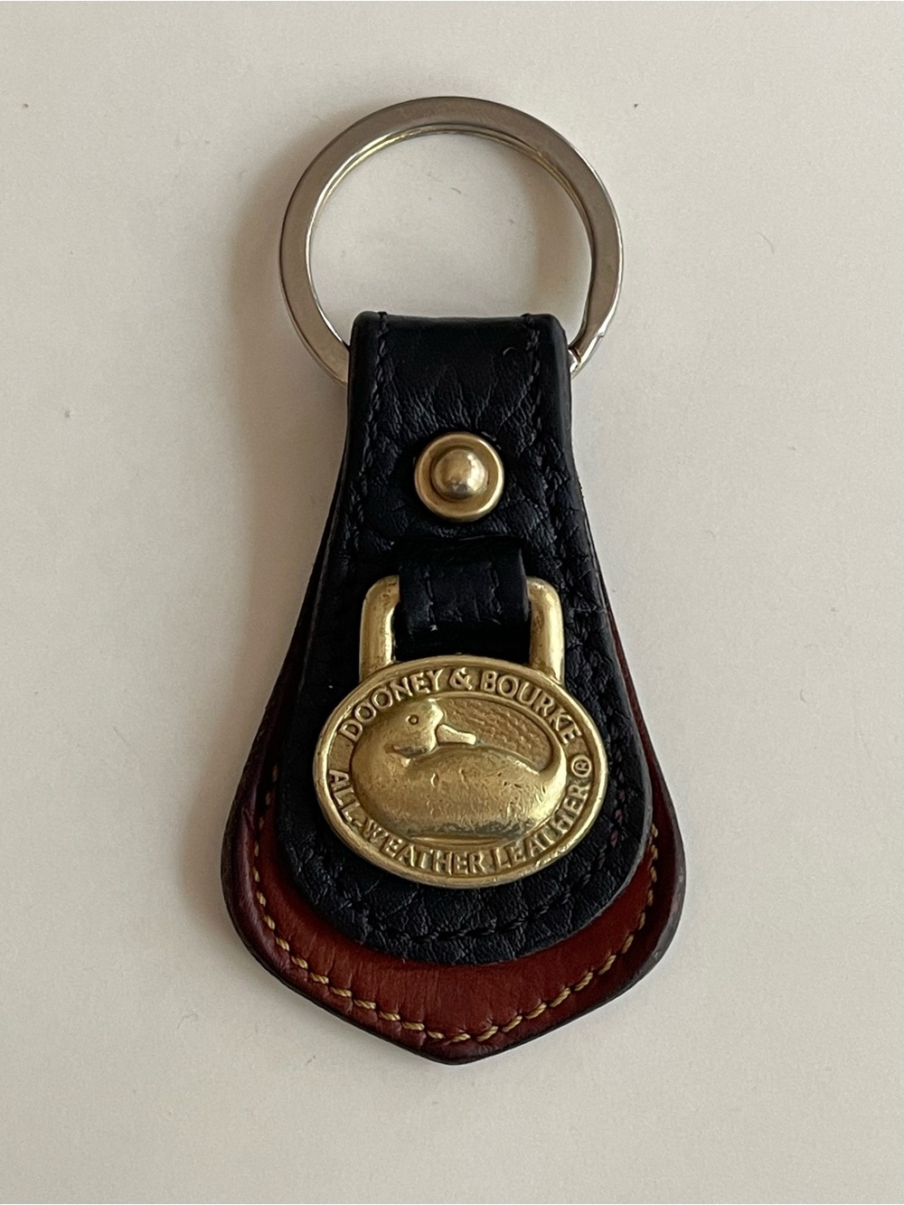 Vintage Dooney & Bourke key fob black and cognac all-weather leather brass duck